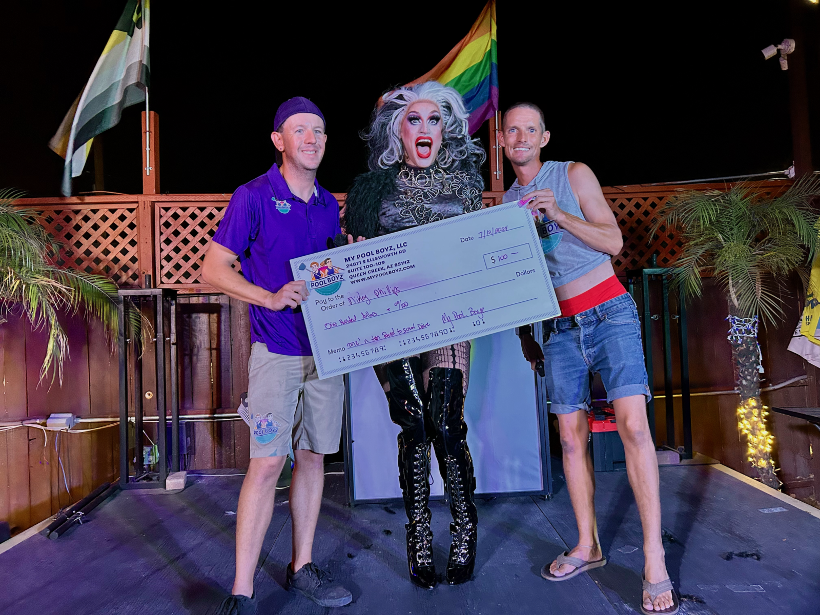 Phoenix arizona drag queen being awarded 100 dollars by My Pool Boyz