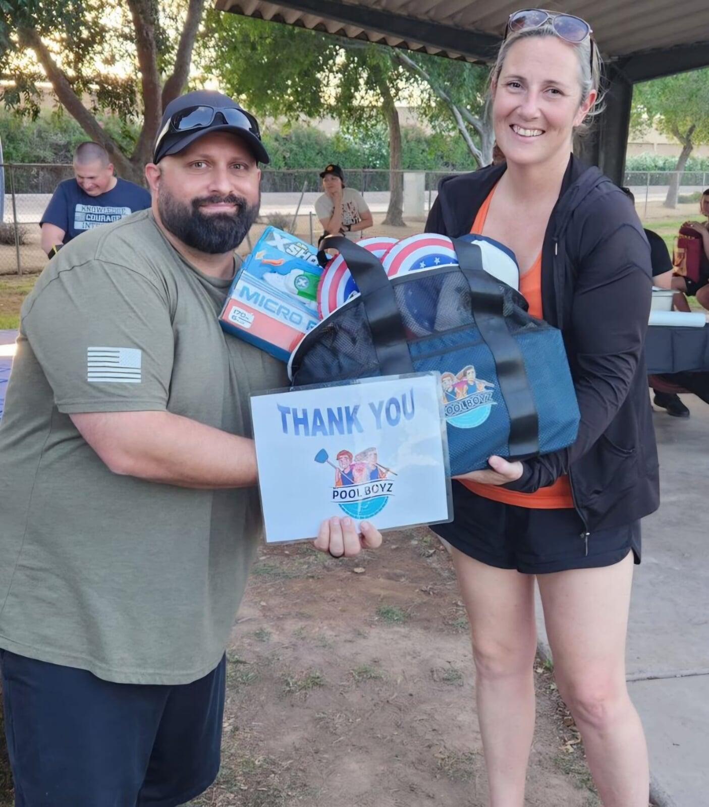 ASU Police gifting Raffle Basket donated by My Pool Boyz