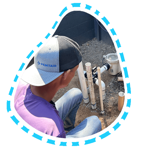 Pool Service technician in phoenix arizona replumbing a pools equipment 